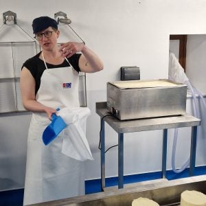 Katy Fenwick teaching at the Courtyard Dairy's cheese making room